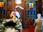 Пономарь Максим читает поздравление епископа Августина